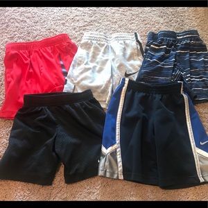 Five pair of kids Nike athletic shorts